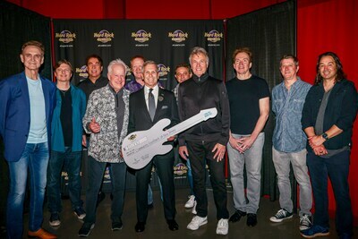 Members Of The Band Chicago, With Hard Rock Hotel & Casino Atlantic City President George Goldhoff, Present A $10,000 Contribution To The Community Foodbank Of New Jersey